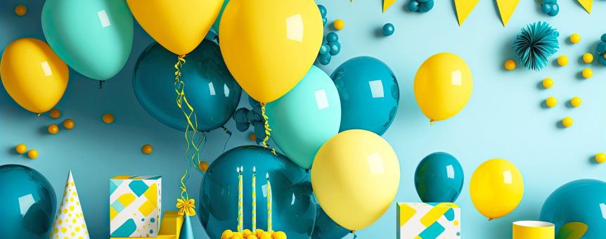 birthday party table and decorations with balloons, confetti and banners in blue yellow tones